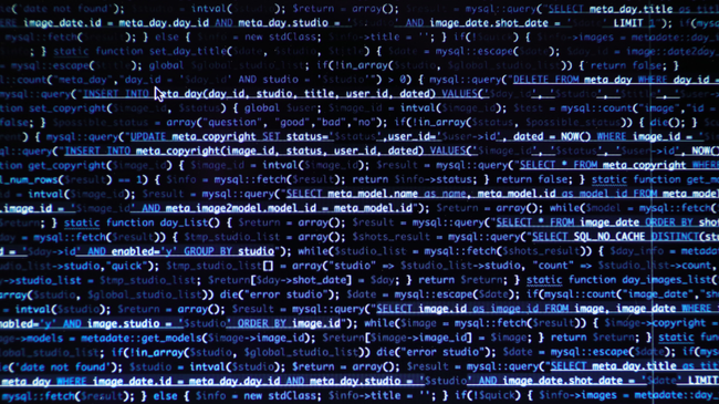 An image of a computer screen with binary code on it